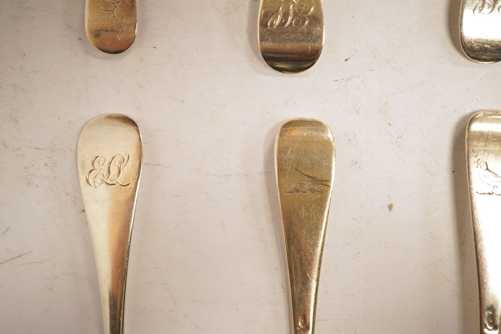 A matched set of seven Queen Anne silver Hanoverian pattern dessert spoons, maker's mark rubbed, five London, 1708, 17.5cm, together with seven other silver base mark Hanoverian pattern dessert spoons, various dates and